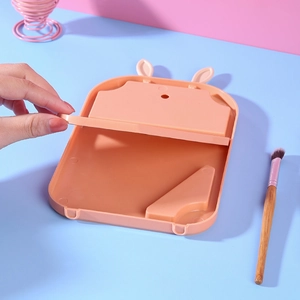Pink rabbit-ear folding makeup mirror and brush cleaning mat for desktop storage
