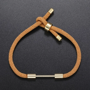 Minimalist brown woven rope bracelet with adjustable gold metal slide and end caps