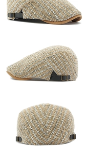 Detail van gebreide tweed textuur met bruine rand en zwarte zijgespen op de pet