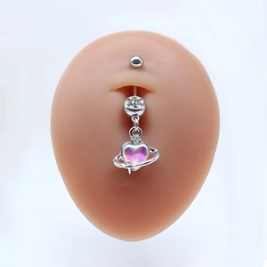 Silver belly button ring with heart planet charm and sparkling rhinestone on model