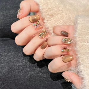 Handmade autumn butterfly press-on nails with brown cat-eye gel and crystal butterfly accents
