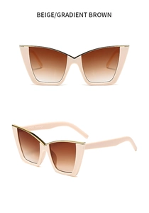 Detail view of beige cat eye sunglasses featuring gradient brown lenses and metal trim