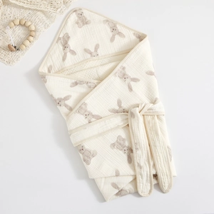 Soft 4-layer cotton gauze swaddle blanket with brown rabbit prints in off-white