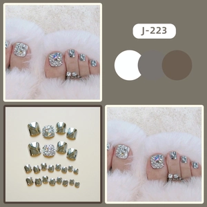Silver mirror finish press-on toenails with sparkling rhinestone accents for pedicure