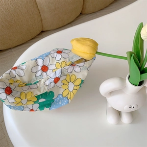 Close-up of floral cotton makeup bag with metal zipper and vibrant tulip background