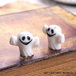 Detailed macro shot of 3D mini ghost figurines on a vintage book for Halloween decor
