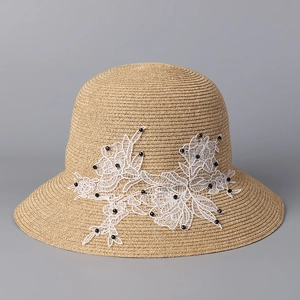 Elegant wide brim straw sun hat for women featuring lace floral detail and black beads