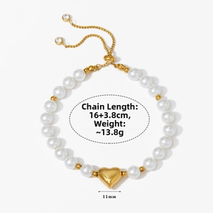 Detail showing the adjustable slide clasp and pearl chain with golden heart pendant