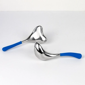 Dual stainless steel mermaid ice globes for facial massage with blue handles on white base
