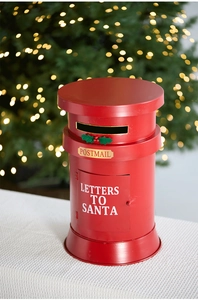 Close-up of a red metal Christmas postbox with Letters to Santa text and holly decor
