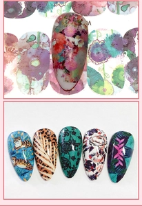 Detailed water transfer nail decals featuring vibrant floral and tiger art patterns