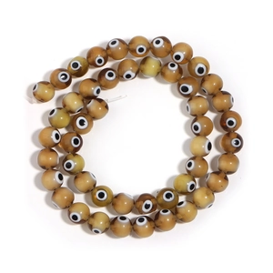 Amber evil eye glass beads for DIY necklaces and bracelets on white background