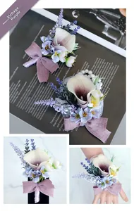 Detail of vintage purple calla lily boutonniere and wrist corsage with lace and pearls