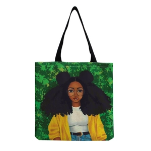 Detail of canvas tote bag featuring stylish Afro woman print and green leaf background
