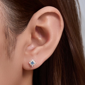 Floral S925 sterling silver stud earrings with blue zircon center and white gemstones