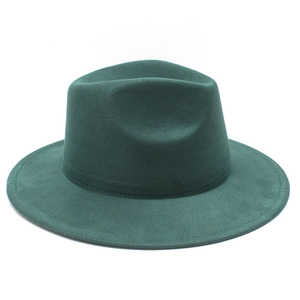 Detail of forest green fedora hat featuring classic teardrop crown and tonal stitching