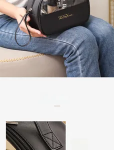 Detail of high-quality stitching and golden logo on black waterproof makeup travel bag