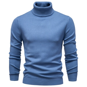 Detail view of the high turtleneck and fine knit texture on a blue men's sweater