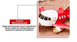 Close-up of red airplane keychain featuring sparkling Czech rhinestones and anti-oxidation finish
