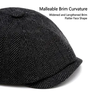 Classic herringbone newsboy cap in dark grey tweed with a wide bendable brim