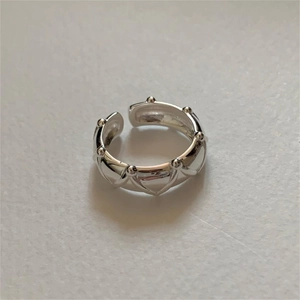 Detail of S925 sterling silver open ring with geometric wave texture and bead edges