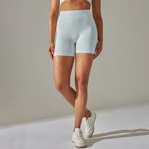 Detailed texture of seamless high-waist light blue yoga shorts with ribbed compression fabric