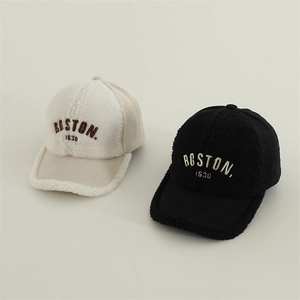 Detail of BOSTON 1630 embroidery on sherpa and corduroy baseball caps for kids