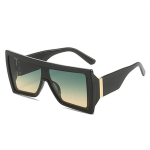 Modern oversized butterfly sunglasses with black frame and gradient tea-green lenses