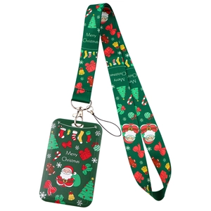 Detail view of green Christmas lanyard and card holder set with festive icons and metal hook