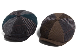 Detail of multi-color patchwork wool newsboy caps with vintage herringbone texture