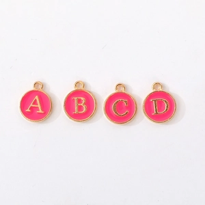 Detail of pink enamel round letter charms A-D with gold plating for DIY jewelry