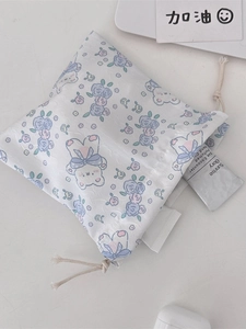 Cute bear and blue flower drawstring storage bag with textured white fabric and ribbon