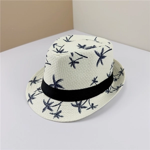 White straw fedora hat with blue coconut palm tree prints and a black decorative band