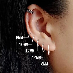 Minimalist silver hoop earrings in sizes 8mm to 16mm displayed on ear for comparison