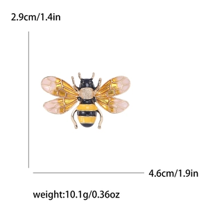 Exquisite bee brooch with enamel finish and dimensions 2.9cm x 4.6cm on white background