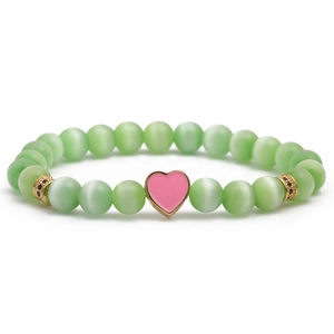 Green cat eye beaded heart charm bracelet with pink enamel and gold-plated hardware