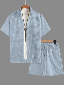 Detail of light blue men's short set showing the unique geometric waffle knit texture