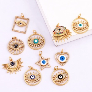 Detailed collection of assorted gold Evil Eye pendants with cubic zirconia accents