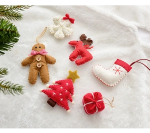 Detailed set of 6 wool felt Christmas ornaments including reindeer and tree on white fur