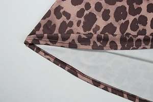 Close-up of double-needle stitching and leopard print texture on this autumn dress