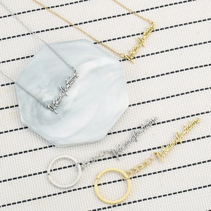 Gold and silver Je t'aime necklaces and Je t'adore keychains set in stainless steel