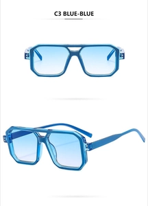 Detail of blue geometric pilot sunglasses featuring a double bridge and gradient lenses