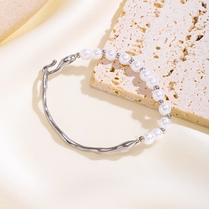 Minimalist titanium steel bracelet with white pearls and irregular silver geometric shapes