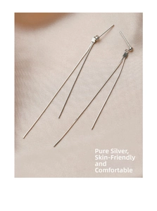 Detail of s925 sterling silver tassel earrings with skin-friendly linear design