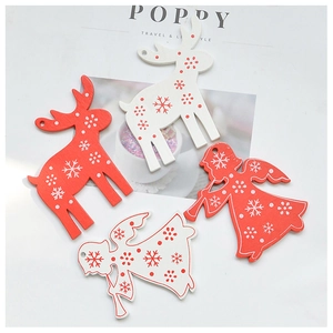 Detailed view of red and white wooden Christmas reindeer and angel ornaments with snowflakes