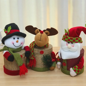 Three festive Christmas candy boxes featuring Santa, snowman, and reindeer fabric designs
