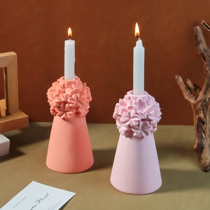 Detailed close-up of floral candle holder featuring 3D flower clusters and base