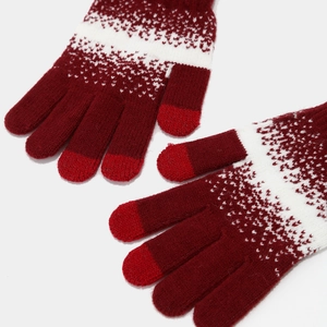 Winter set featuring burgundy and white knit touchscreen gloves with snowflake patterns