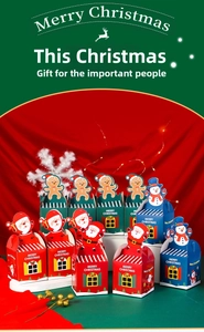 Detailed view of festive house-shaped Christmas apple gift boxes with cartoon characters