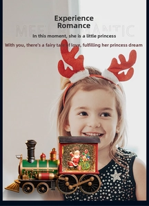 Close-up of a vintage Christmas train snow globe featuring Santa Claus and sparkling glitter